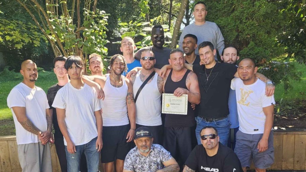 a group photo of men in rehabilitation for drugs after a walk