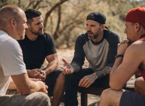 Men In an Addiction Treatment Program in Arizona Talking Outside on a Hike