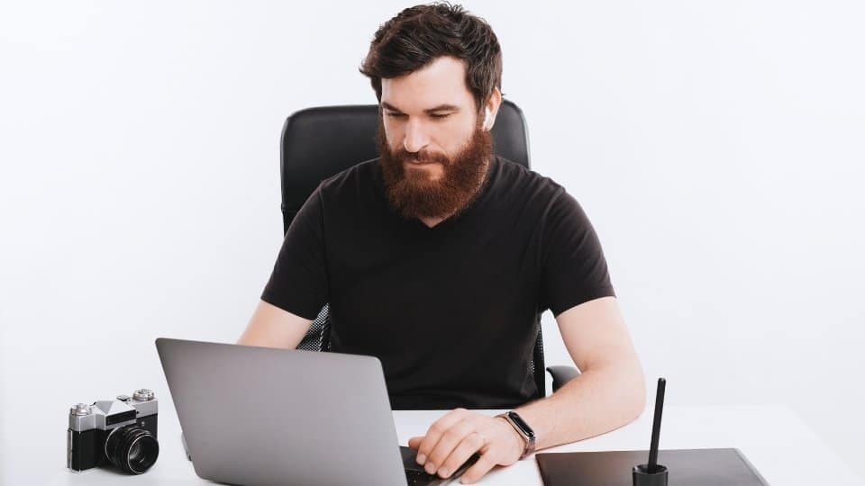 how addictive is Adderall a man sits at a desk looking up the answer