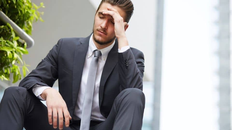 recovery for men is something this man wearing a suit needs for his addiction