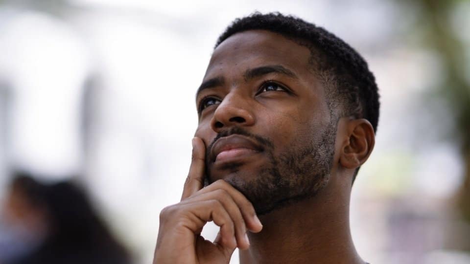 beer vs liquor, a man thinking about the difference.