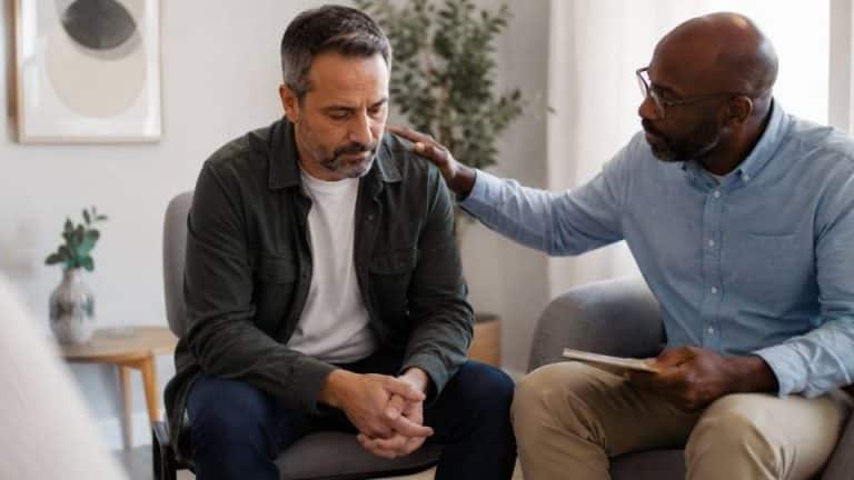 IOP Group Topics hero image showing men working together in group therapy.